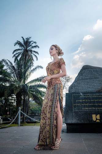evening dress standing woman near rock robe